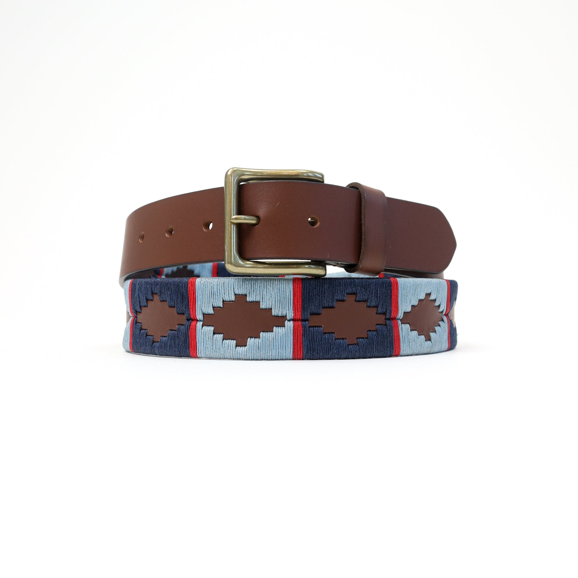 A handmade Italian leather belt with a rich brown base and a neutral-toned Aztec woven pattern, completed with a brass-tone buckle.