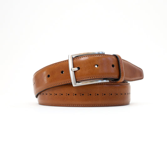 A handmade Italian perforated tan leather belt featuring a silver-tone buckle, elegantly rolled for display.