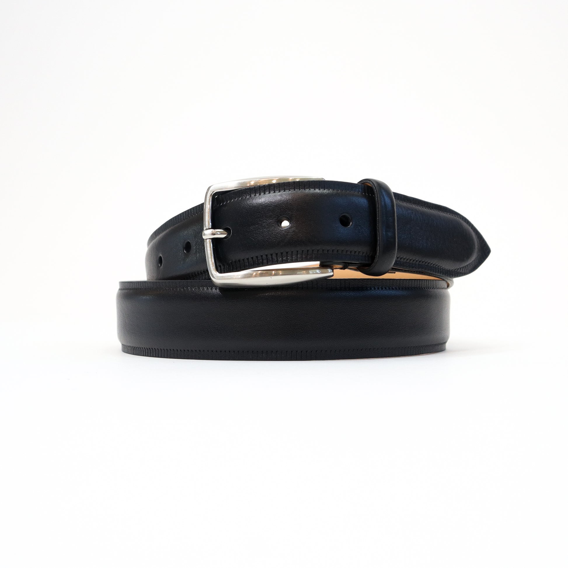 A handmade Italian black leather belt featuring a sleek silver-tone buckle, neatly coiled for a refined presentation.