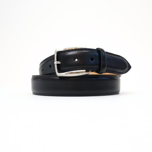 A handmade Italian black leather belt featuring a sleek silver-tone buckle, neatly coiled for a refined presentation.