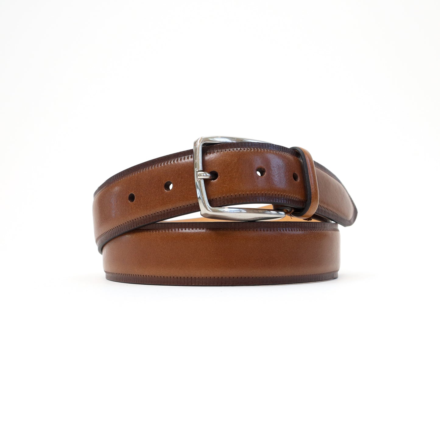 A handmade Italian brown leather belt with a smooth finish and a silver-tone buckle, elegantly rolled for display.