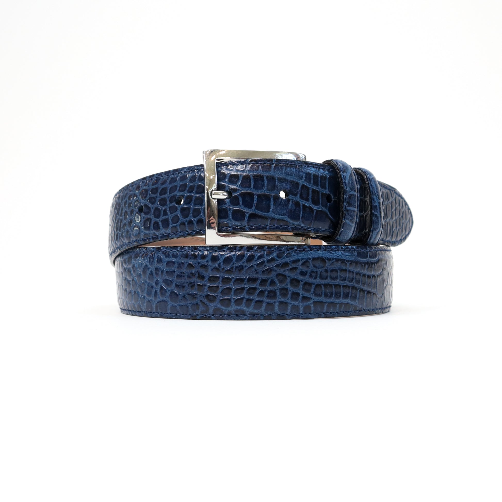 A deep navy blue croc-embossed leather belt with a silver-tone stretchable Magic Flex buckle