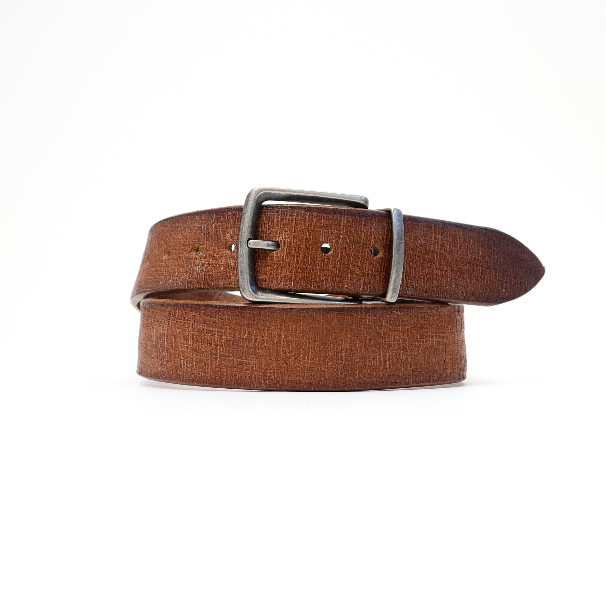 A warm tan Magic Flex leather belt with a silver-tone stretchable buckle