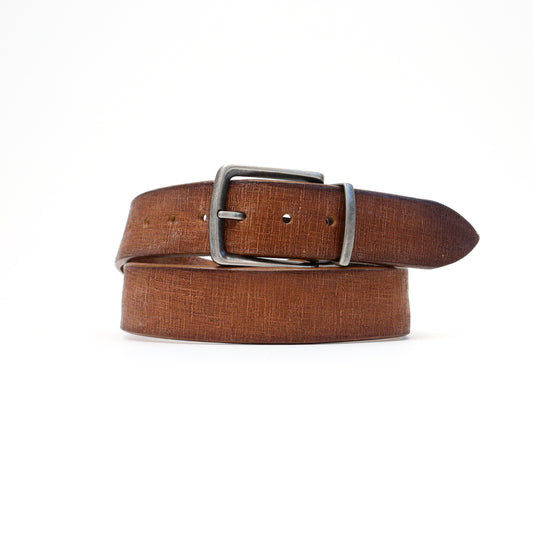 A warm tan Magic Flex leather belt with a silver-tone stretchable buckle