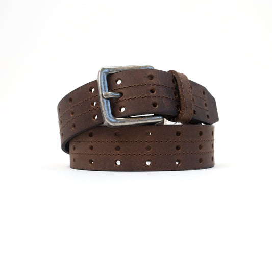 A handmade Italian perforated brown leather belt featuring a silver-tone buckle, elegantly rolled for display.