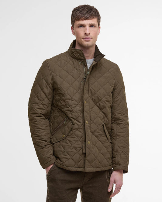 Quilted jacket with studded flap pockets and additional zipped pocket for extra security, adjustor tabs at back, needlecord to inner collar and contrast coloured lining.