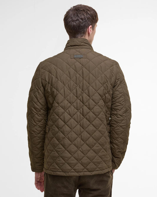 Quilted jacket with studded flap pockets and additional zipped pocket for extra security, adjustor tabs at back, needlecord to inner collar and contrast coloured lining.