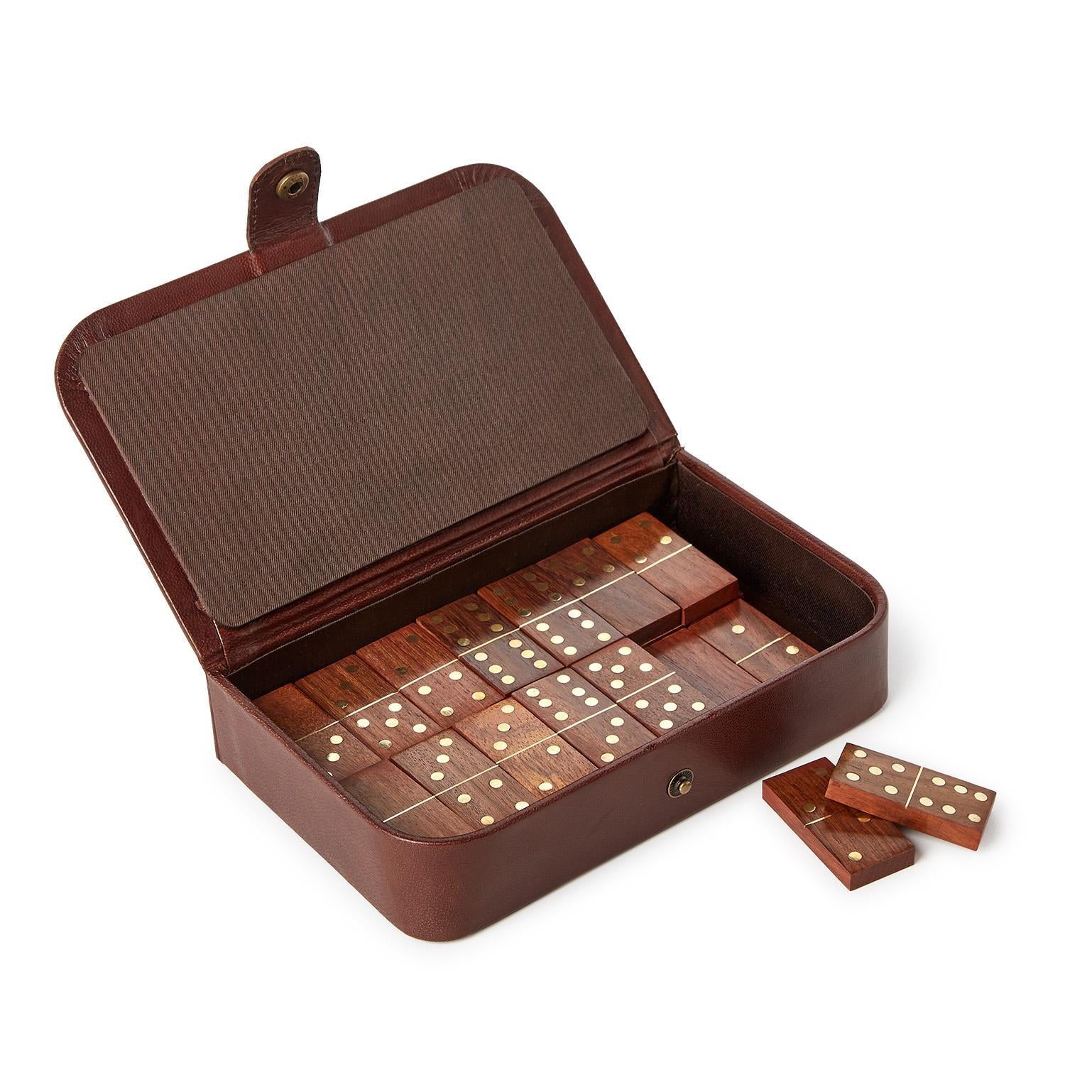 Wooden domino set in a brown leather case 