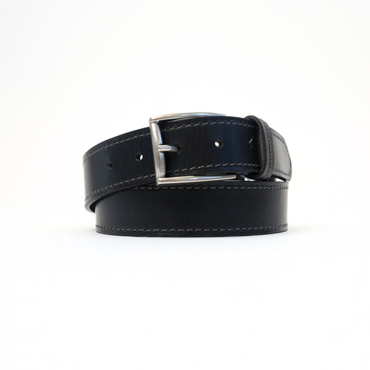 A handmade Italian black leather belt with contrast stitching and a silver-tone buckle, neatly rolled for a sleek display.
