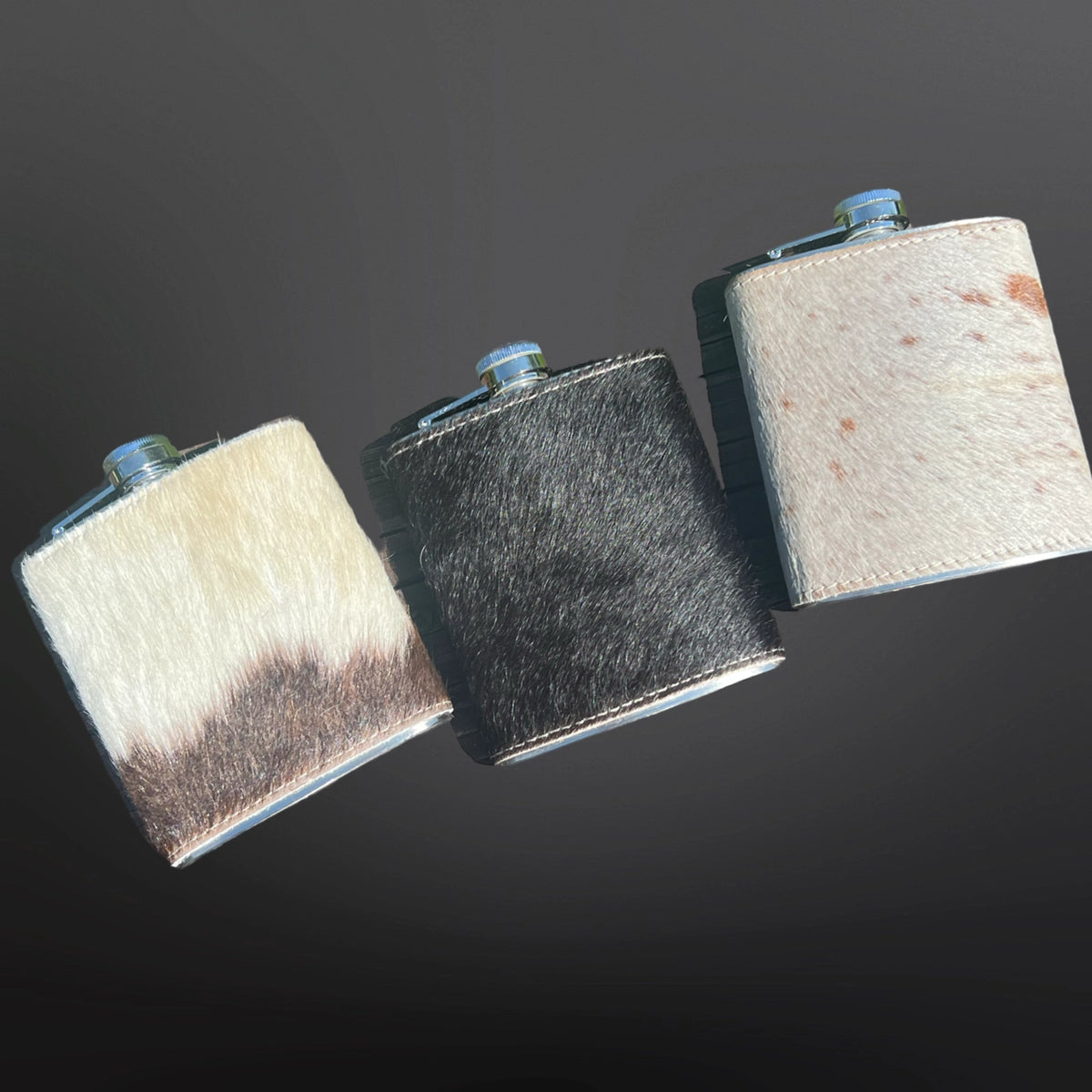 This stainless steel flask is covered in genuine cowhide each with it's own unique design. The perfect size to fit in a coat pocket and makes a great gift!